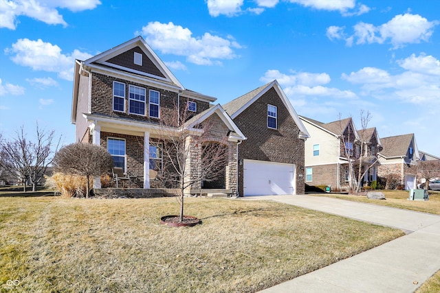 traditional home featuring a garage, a front yard, brick siding, and driveway