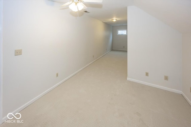 unfurnished room featuring light carpet, baseboards, visible vents, and ceiling fan