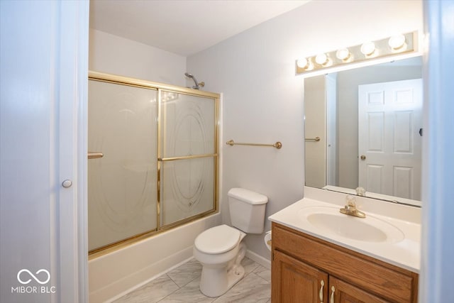 full bathroom with marble finish floor, vanity, toilet, and bath / shower combo with glass door