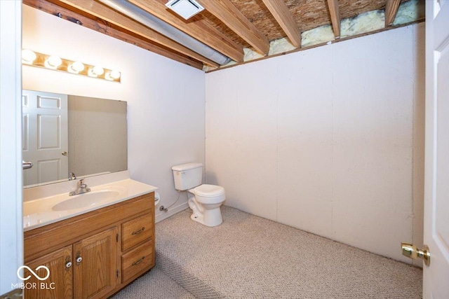 half bathroom featuring toilet, vanity, and visible vents