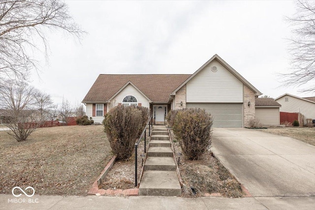 single story home featuring a garage, fence, concrete driveway, and brick siding