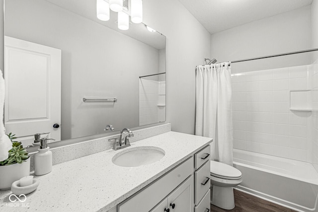 full bath featuring toilet, wood finished floors, vanity, and shower / bath combination with curtain