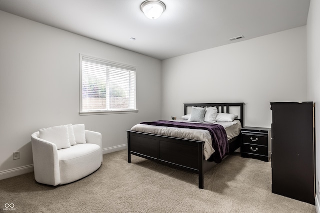 bedroom with visible vents, carpet flooring, and baseboards