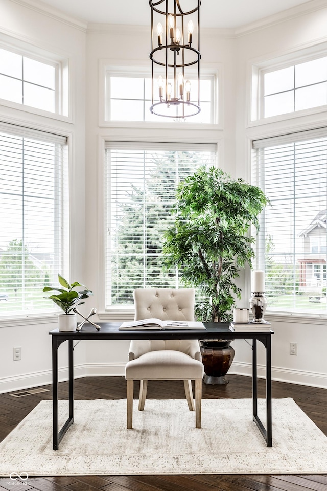home office featuring crown molding, baseboards, plenty of natural light, and an inviting chandelier