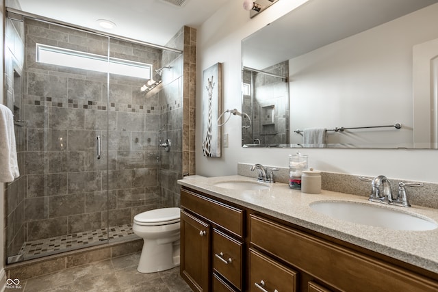 full bathroom with a sink, a stall shower, and toilet