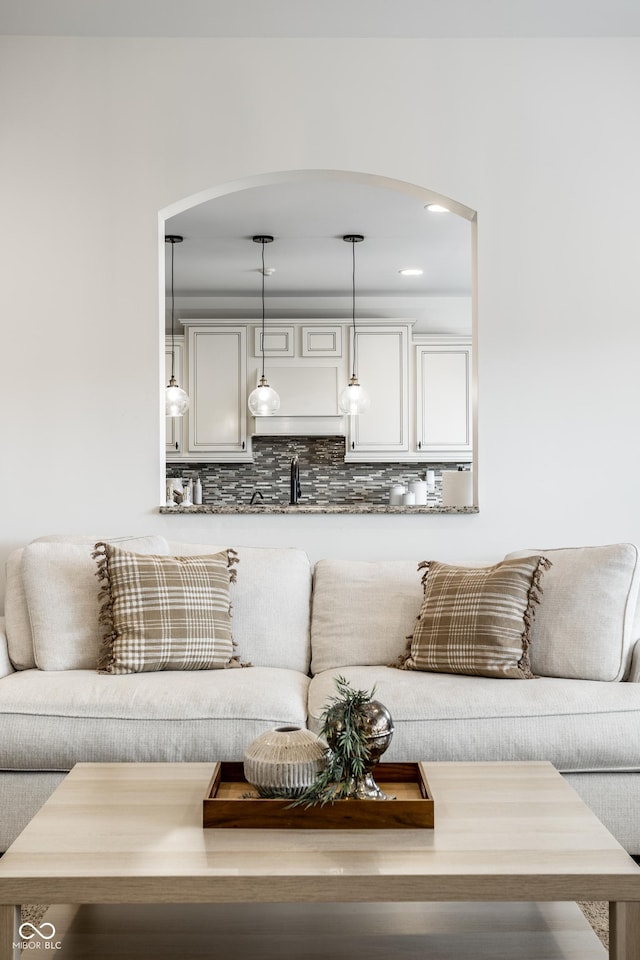 living area with arched walkways