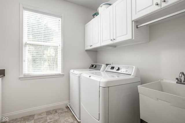 laundry room with independent washer and dryer, baseboards, a sink, and cabinet space