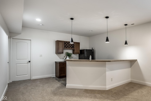 bar with baseboards, freestanding refrigerator, and light colored carpet