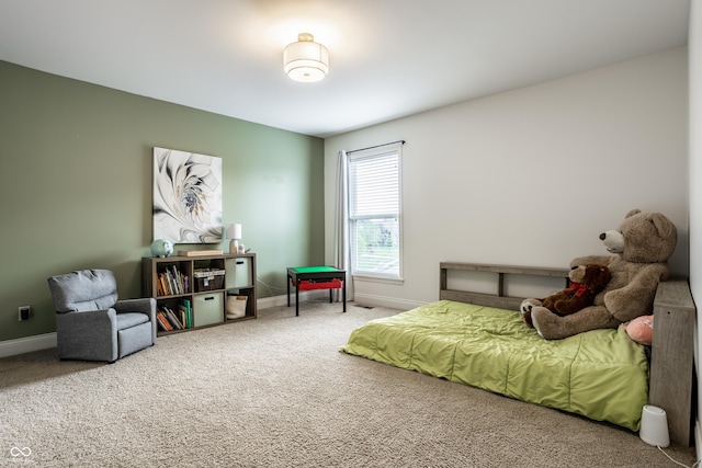 carpeted bedroom with baseboards