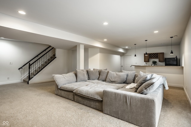 living area with baseboards, carpet flooring, and recessed lighting