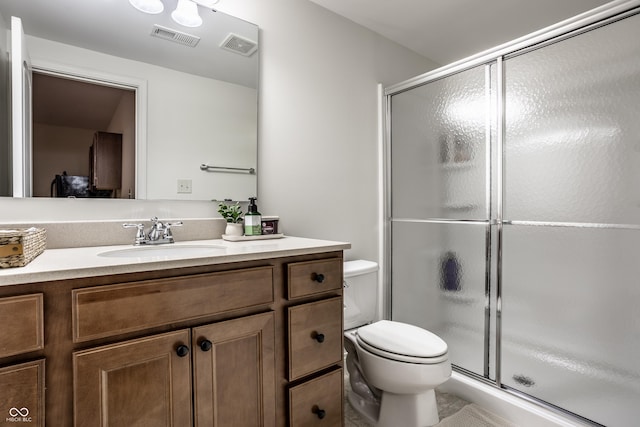 full bath with visible vents, vanity, toilet, and a shower stall