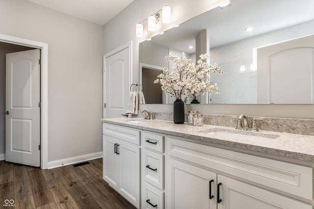 804 Whispering Oaks Dr, Carmel, IN 46032 - full bath with double vanity, wood finished floors, baseboards, and tiled shower