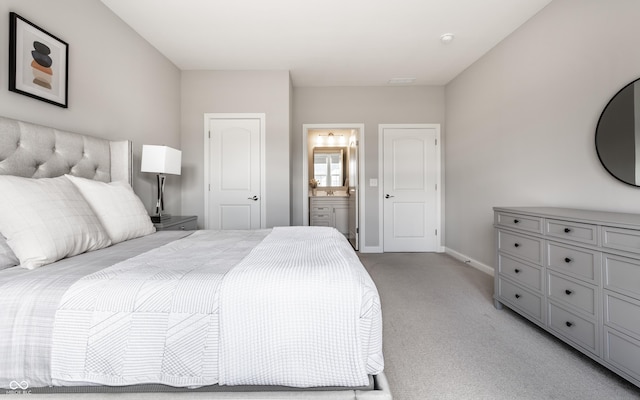 804 Whispering Oaks Dr, Carmel, IN 46032 - bedroom featuring light colored carpet, baseboards, and connected bathroom