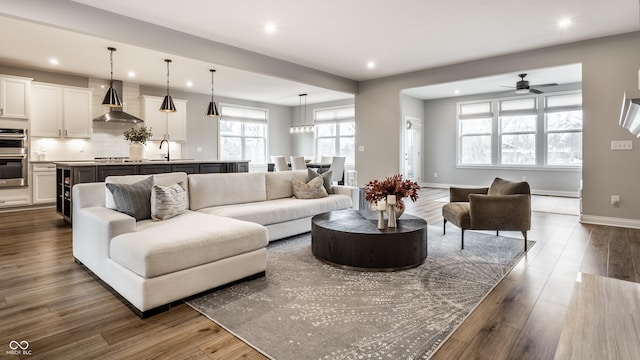 804 Whispering Oaks Dr, Carmel, IN 46032 - living area with recessed lighting, a ceiling fan, dark wood-style floors, and baseboards