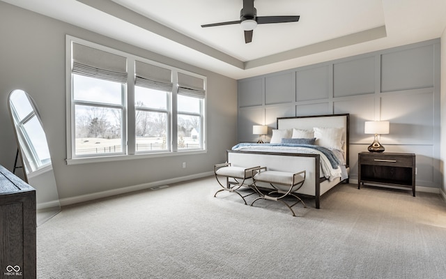 804 Whispering Oaks Dr, Carmel, IN 46032 - bedroom with light colored carpet, a raised ceiling, and baseboards