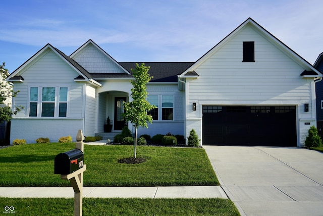 804 Whispering Oaks Dr, Carmel, IN 46032 - view of front of property with concrete driveway, a front lawn, brick siding, and an attached garage