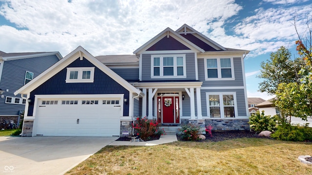 craftsman house with stone siding, concrete driveway, a front lawn, and a garage