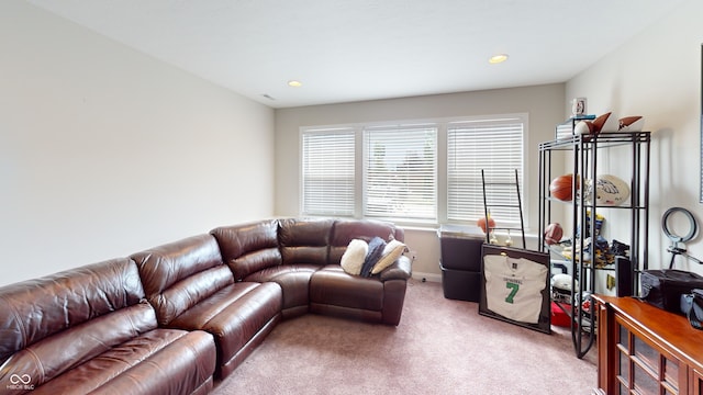 living area with recessed lighting, baseboards, and light colored carpet