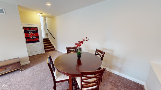 dining room with carpet floors, recessed lighting, visible vents, baseboards, and stairs