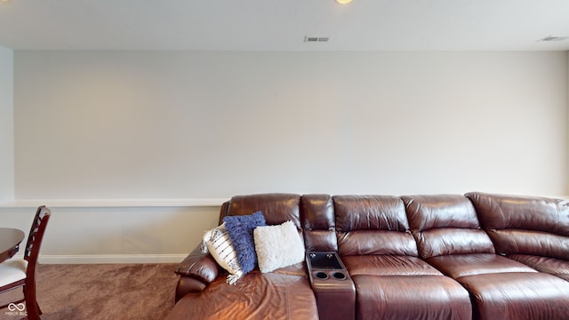 living room with carpet, visible vents, and baseboards