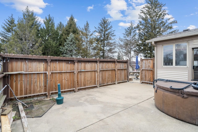 view of patio featuring fence