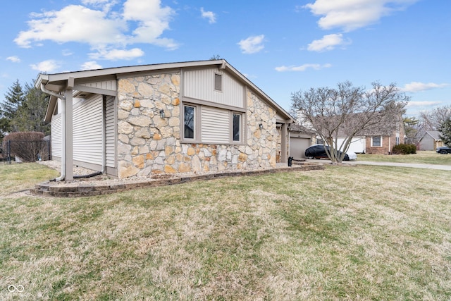 view of side of property with stone siding and a yard