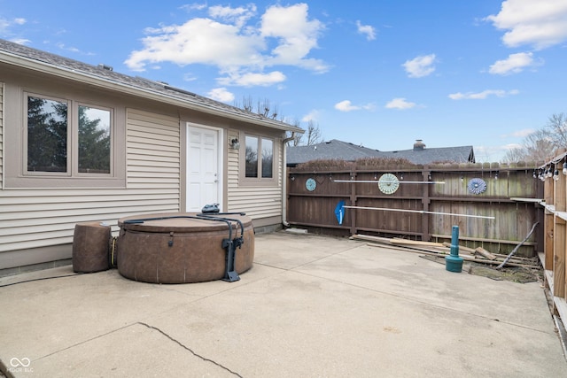 view of patio featuring fence