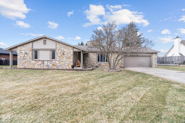 view of front of home featuring a garage, fence, concrete driveway, and a front yard