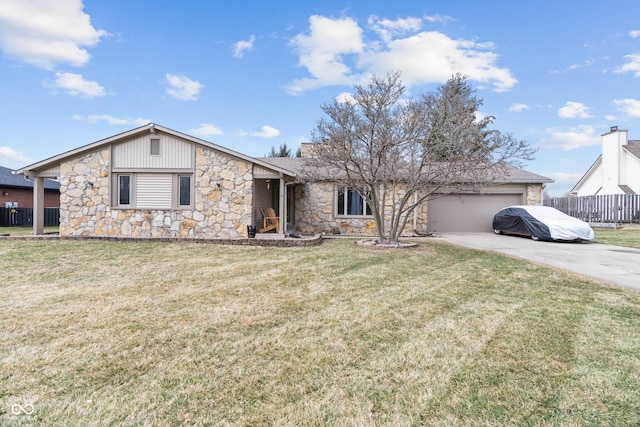 view of front of house with concrete driveway, a front lawn, and fence