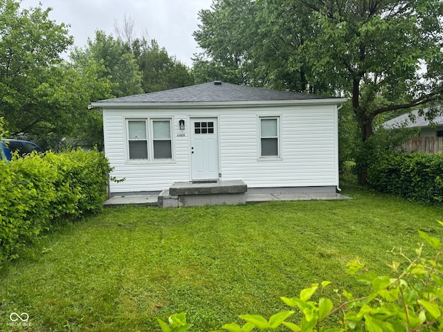 1323 S Ewing St, Indianapolis, IN 46203 - back of property with a lawn and roof with shingles