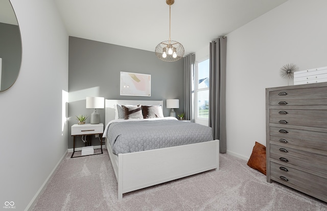 bedroom featuring carpet, baseboards, and a notable chandelier