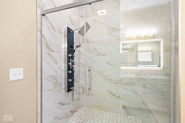 full bathroom featuring a marble finish shower