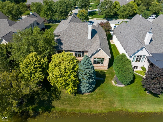 bird's eye view featuring a water view and a residential view