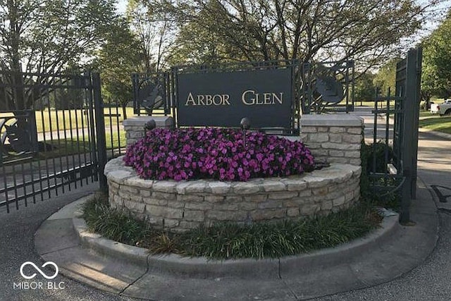 community sign with fence