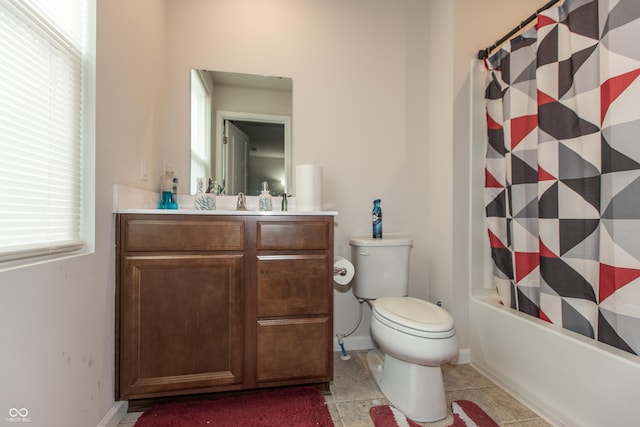 full bathroom with toilet, shower / bath combo, vanity, and tile patterned floors