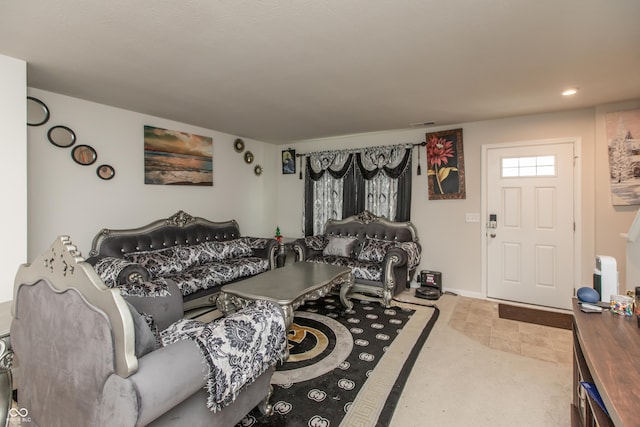 living area featuring baseboards