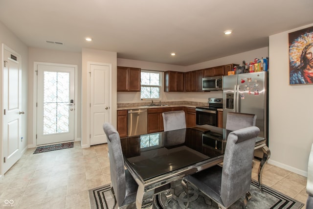 dining area with baseboards, visible vents, and recessed lighting