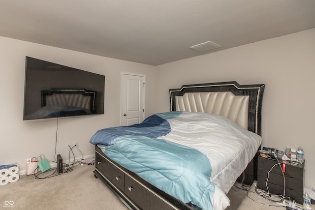 carpeted bedroom with baseboards and visible vents