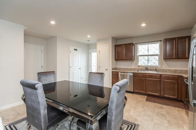 dining space with baseboards and recessed lighting