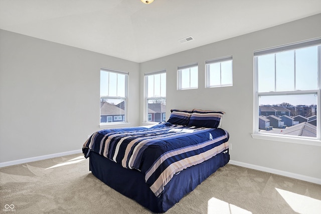 bedroom featuring carpet flooring, visible vents, and baseboards