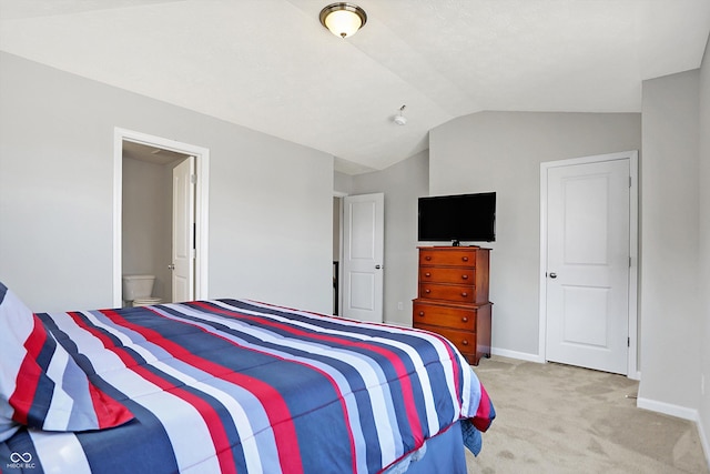 bedroom with light carpet, baseboards, and lofted ceiling