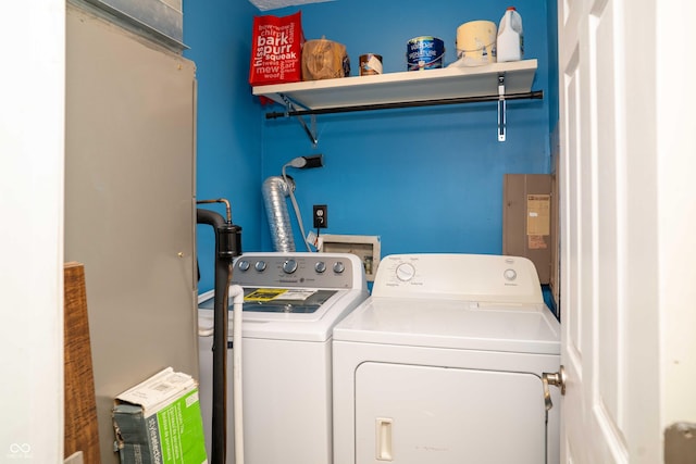 clothes washing area with laundry area and washer and dryer