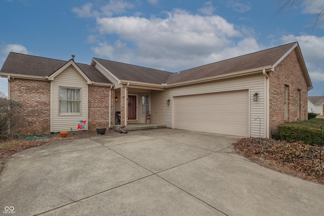 single story home featuring an attached garage, concrete driveway, and brick siding