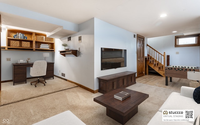 carpeted living area featuring stairway, visible vents, baseboards, and recessed lighting