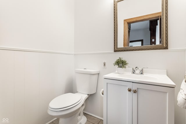 bathroom featuring toilet and vanity