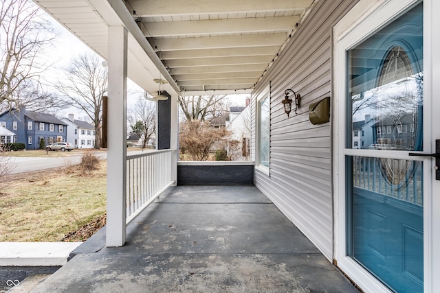 view of patio / terrace featuring covered porch and a residential view