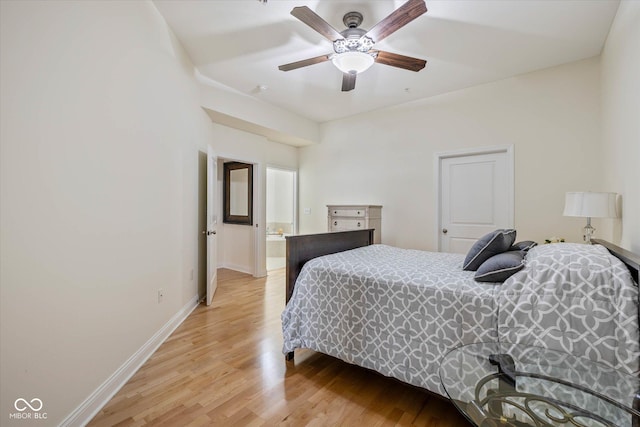 bedroom with light wood-type flooring, a ceiling fan, and baseboards