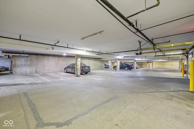 parking garage featuring a garage door opener