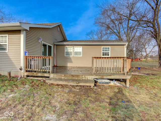 back of house with a wooden deck