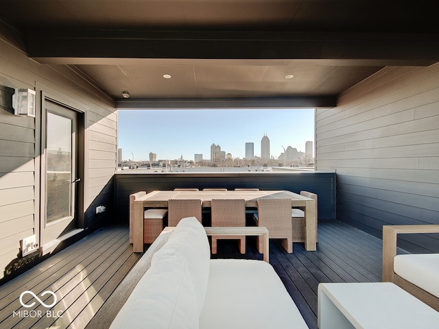 wooden deck featuring a city view